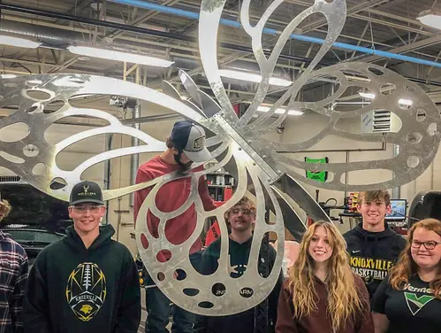 Knoxville's manufacturing school-based enterprise creates projects, like this metal butterfly statue, for the community.