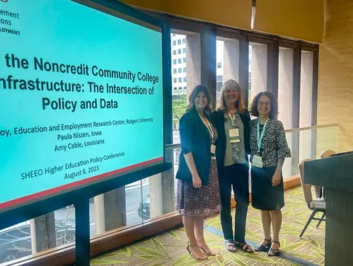 Iowa's Paula Nissen (middle) partnered with representatives from Louisiana (left) and Rutgers University (right) to promote noncredit program data.