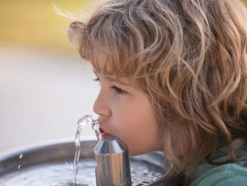 student drinking water