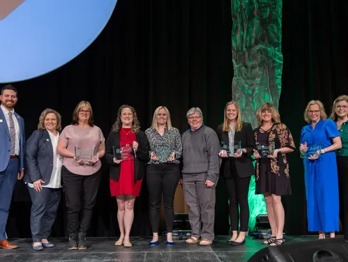 The six awardees of the 2024 Iowa STEM Teacher Award pose with Department of Education Staff.