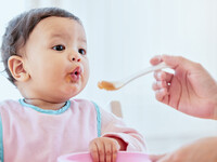 Mother feeding infant