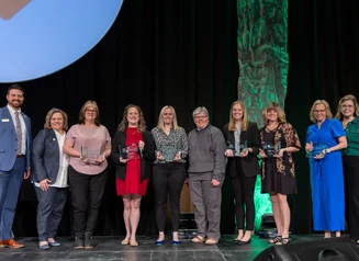 The six awardees of the 2024 Iowa STEM Teacher Award pose with Department of Education Staff.