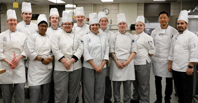 The ICI students gather together before the work begins in the kitchen.